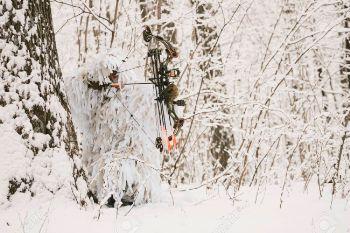 145672 103640857 bowhunter in snow ghillie suit